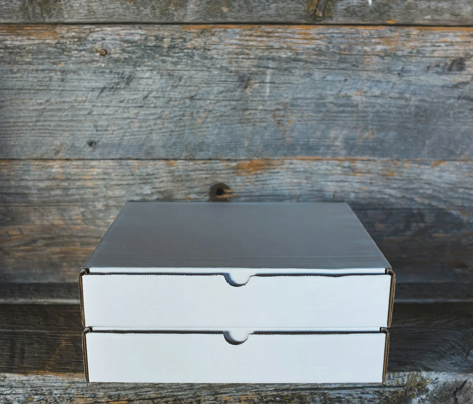 GST registration process for ecommerce sellers in India with shipping boxes and a desk