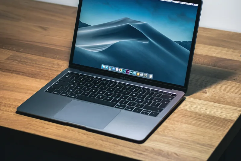 Freelancer comparing income details on a laptop desk