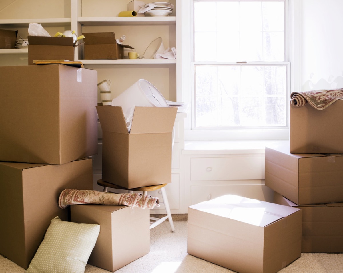 Stack of packed cardboard moving boxes ready for house shifting
