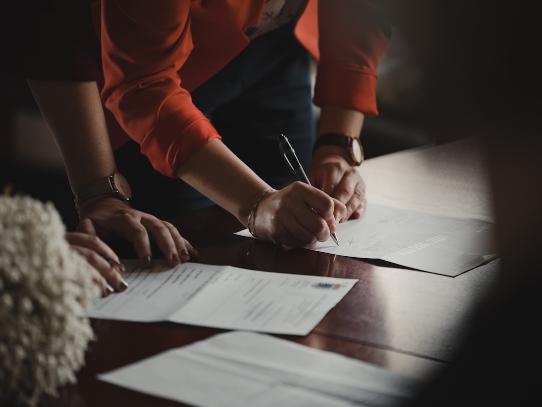 Business owner consulting a CA or trademark agent about registration fees